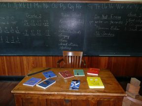 classroom desk and chalkboard
